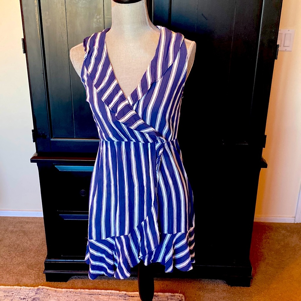 Cute navy/white striped dress. Ruffle front. Elastic waist. Pullover. Size S.